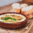 Foto de  Provoleta al horno con tomate seco