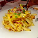 Foto de Porción fritas con bacon y cheddar 